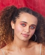 person wearing red smokey eyeshadow