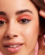 person wearing colorful eyeshadow