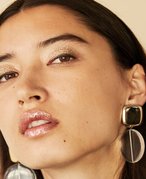 person wearing glitter eye and lip makeup