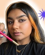 person holding valentino eyeliner