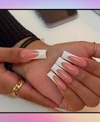 manicured acrylic coffin nails on pink background
