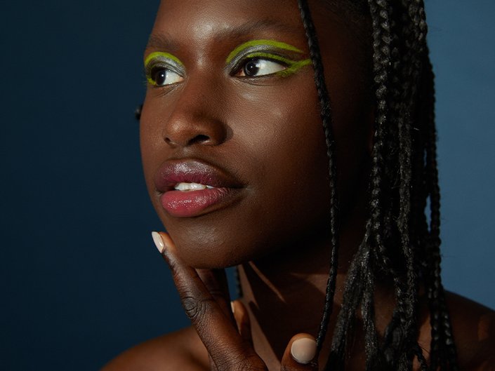 green lipstick on dark skin