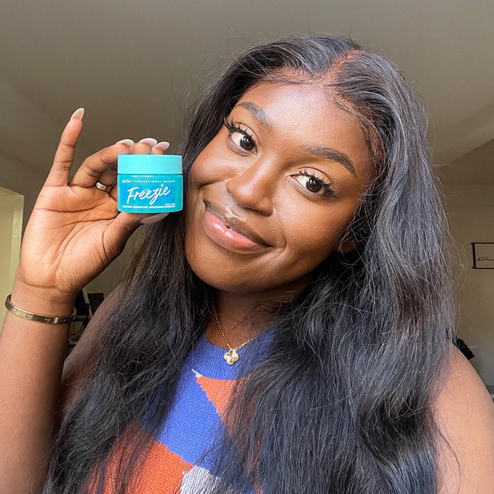 sarah holding the NYX Professional Makeup Face Freezie Cooling Primer + Moisturizer