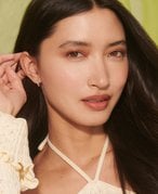 Picture of a model with dark, curled hair