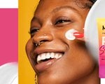 Woman applying NYX sunscreen to face