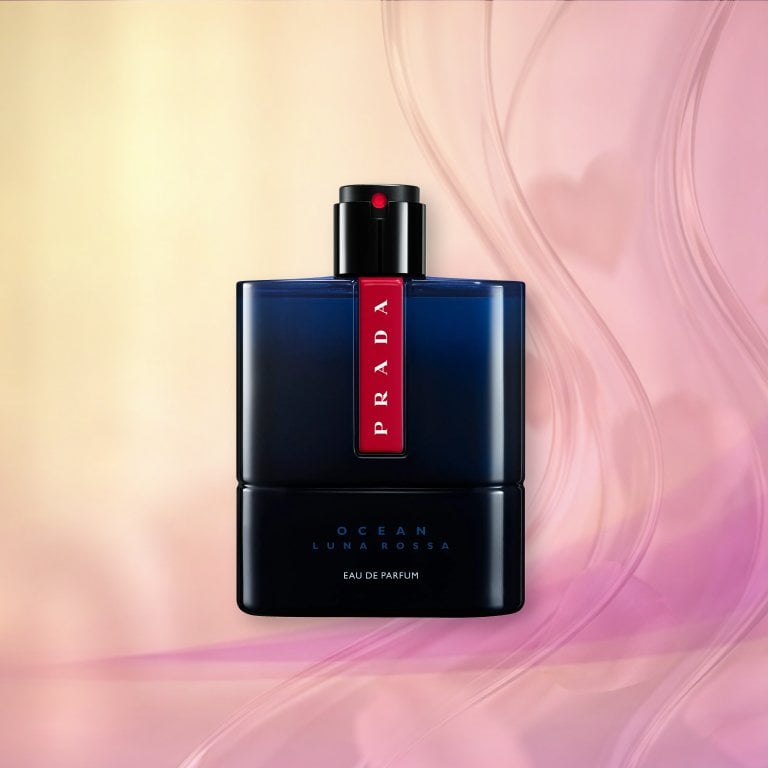 Bottle of Prada Beauty Luna Rossa Ocean Eau de Parfum on a pink textured background