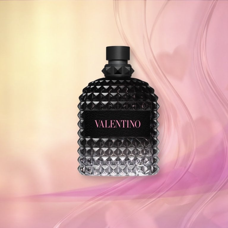 Bottle of Valentine Born in Roma Uomo Eau de Toilette on a pink textured background