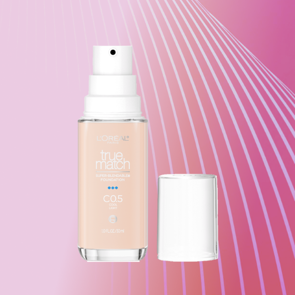 A bottle of L’Oreal True Match Foundation on a pink background